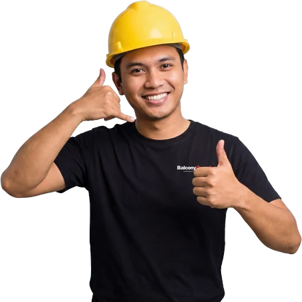 BalconyGuard technician in a hard hat — WhatsApp us to book your invisible balcony grill installation