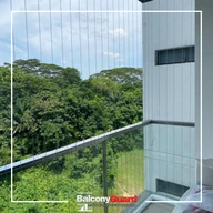 Balcony grill glass area secured with invisible grille