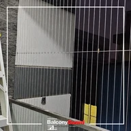 Condo balcony grill upgraded to invisible safety grill