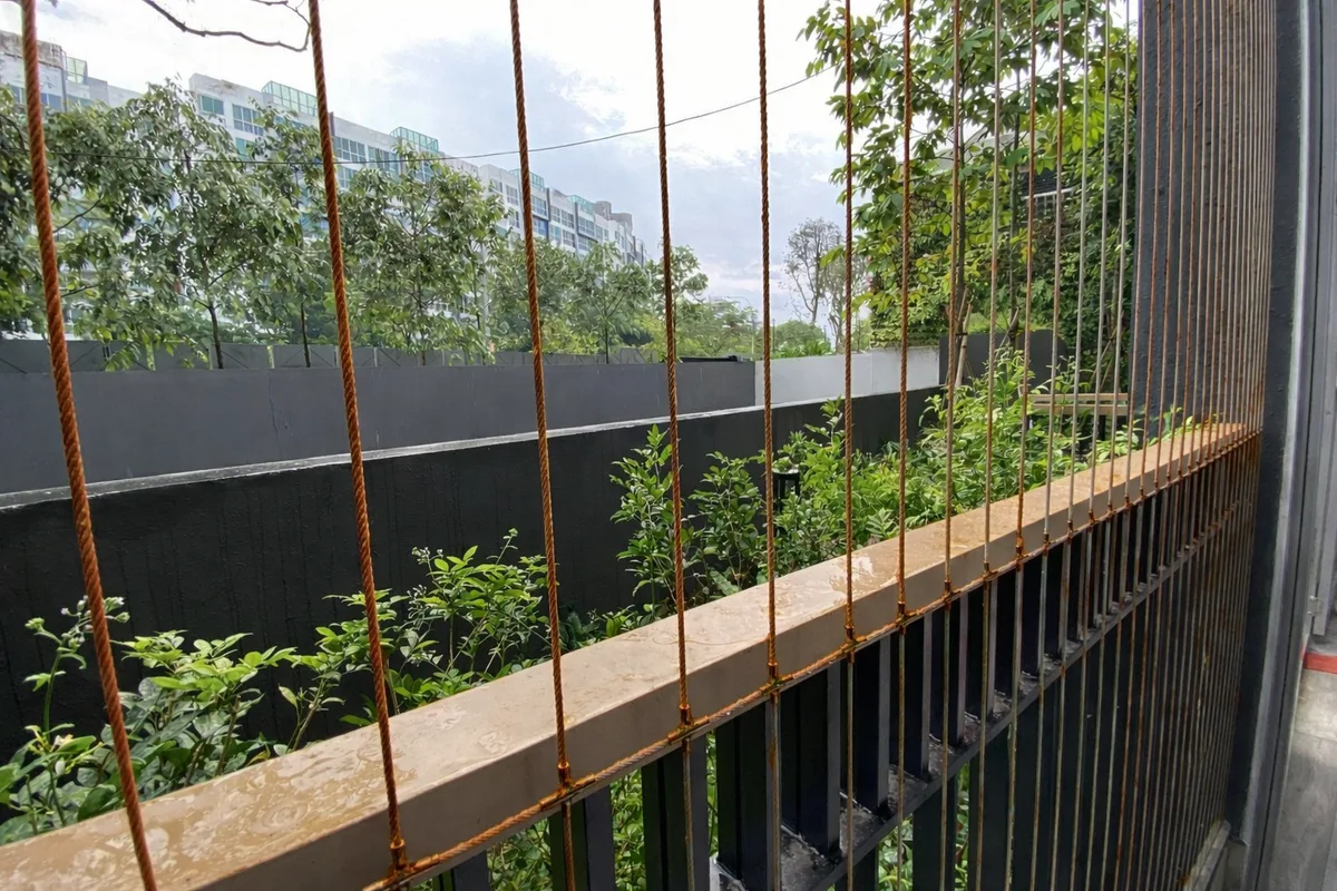Installation of invisible grill on the condominium balcony for safety without blocking the view.