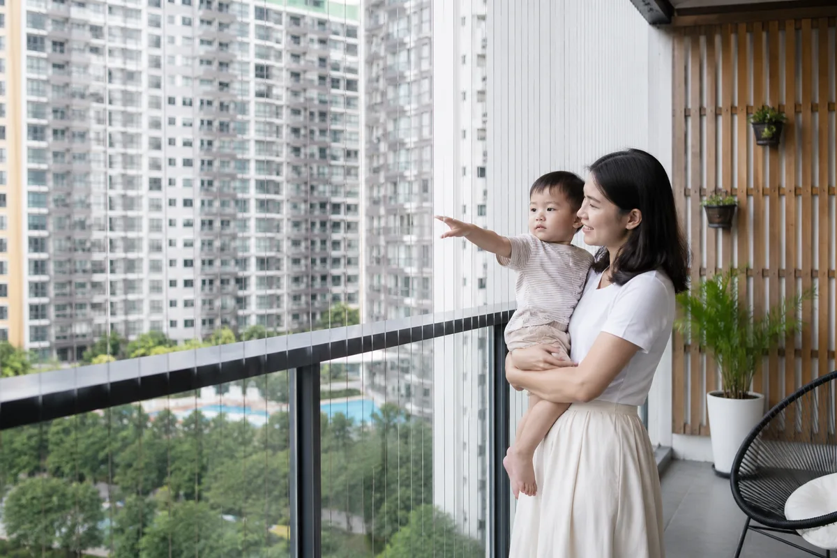 Condo balcony with invisible grille protecting toddler safely